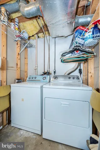 a view of a house with a wooden deck and a yard