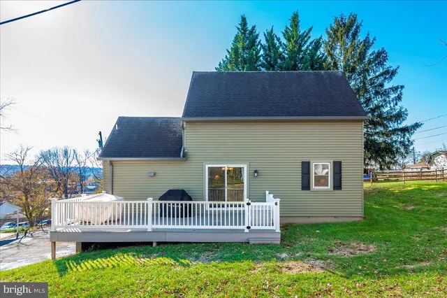 a view of a balcony with wooden floor