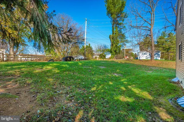 a front view of a house with a yard and a garage