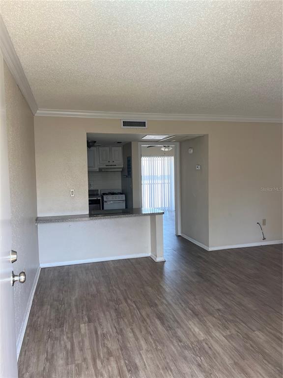 136 Blue Pointe Way, Unit 310 Altamonte Springs, FL 32701 - Photo 3 of 10 a view of empty room with wooden floor
