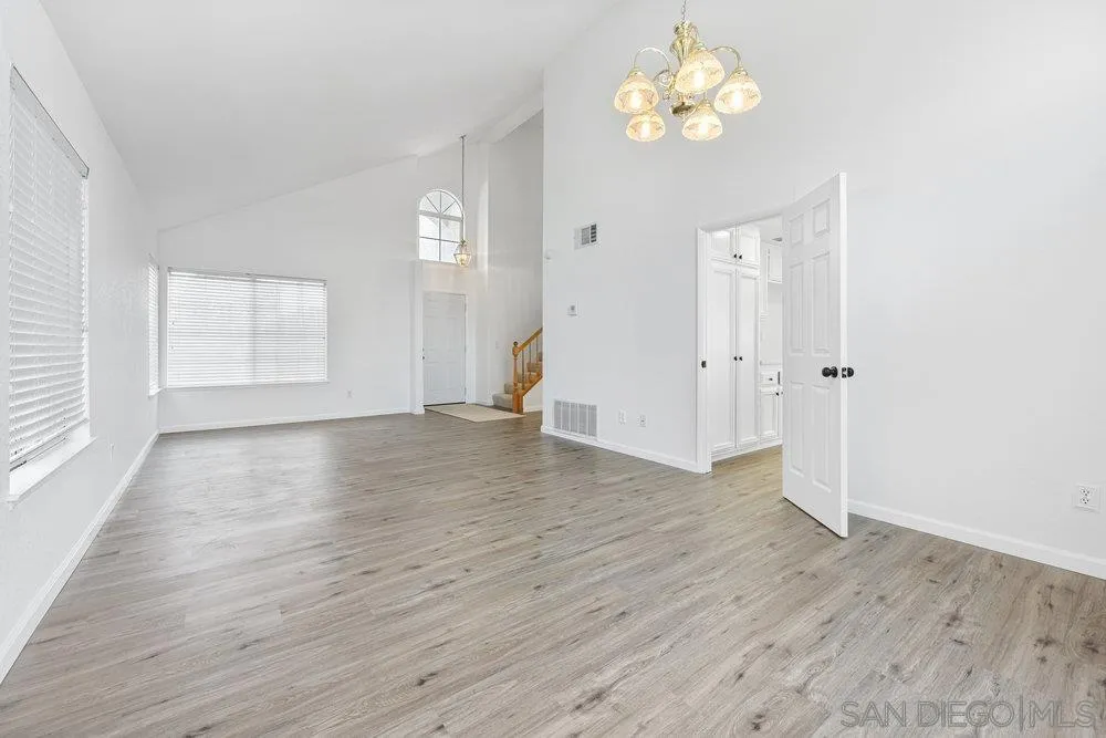 30156 Silver Ridge Court Temecula, CA 92591 - Photo 4 of 23 wooden floor in an empty room with a window