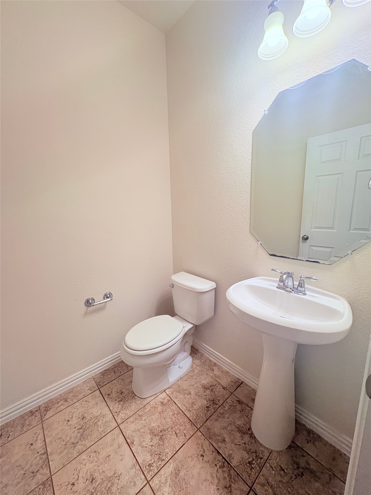 16029 Hampton Bliss Trace Austin, TX 78728 - Photo 2 of 15 a bathroom with a toilet sink and mirror