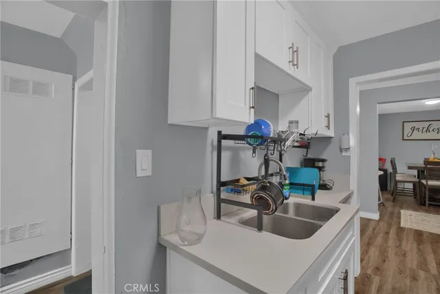 a kitchen with a sink and cabinets