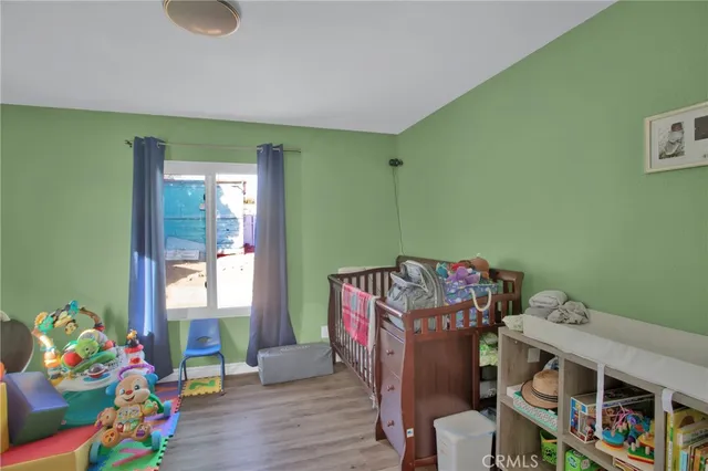 a living room with baby crib furniture and a baby crib