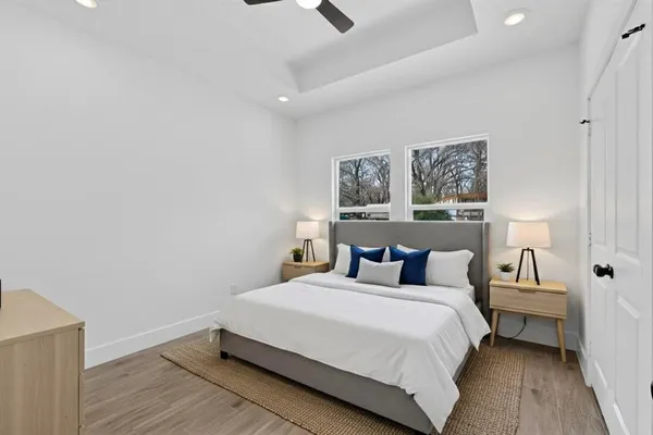 a bedroom with a bed and lamp