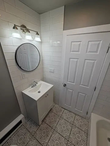 a view of an empty room and wooden floor