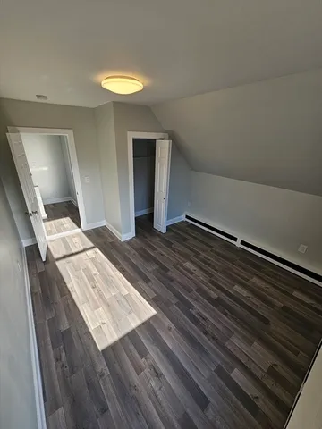 a view of entryway with wooden floor