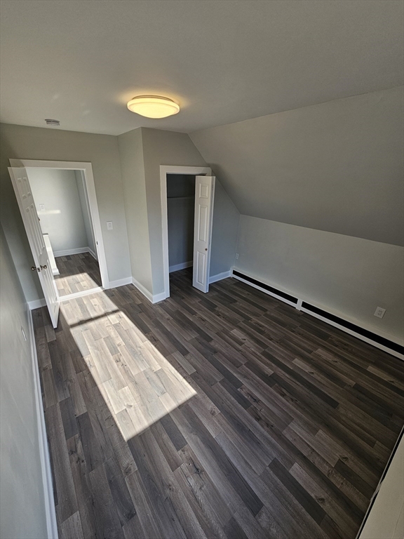 46 Dennis Street, Unit 3 Boston, MA 02119 - Photo 13 of 22 a view of an empty room and wooden floor