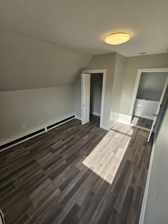 46 Dennis Street, Unit 3 Boston, MA 02119 - Photo 16 of 22 a view of a room with wooden floor and staircase