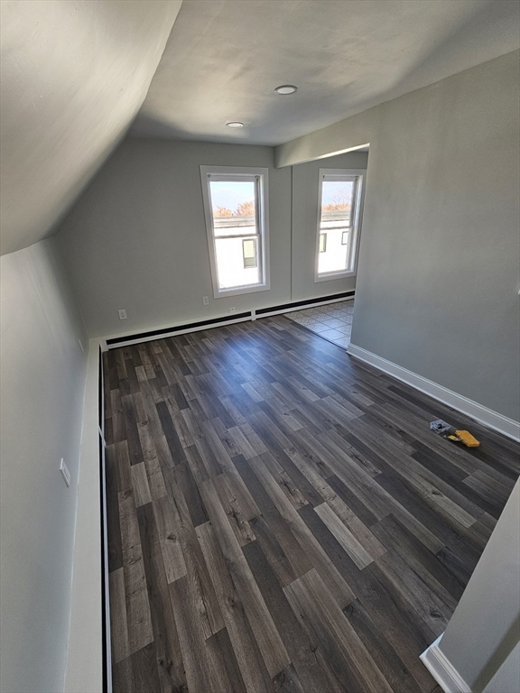 46 Dennis Street, Unit 3 Boston, MA 02119 - Photo 18 of 22 a view of empty room with window and wooden floor