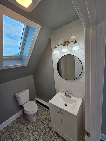 a bathroom with a sink and mirror