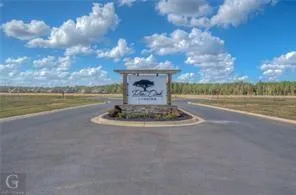 a view of a lake with a big yard