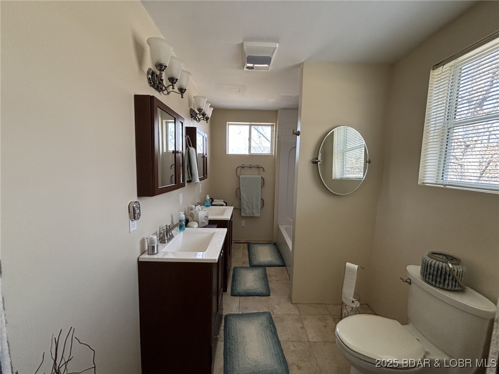 1265 Lick Creek Road Edwards, MO 65326 - Photo 20 of 27 upper level bathroom, double vanity tub shower