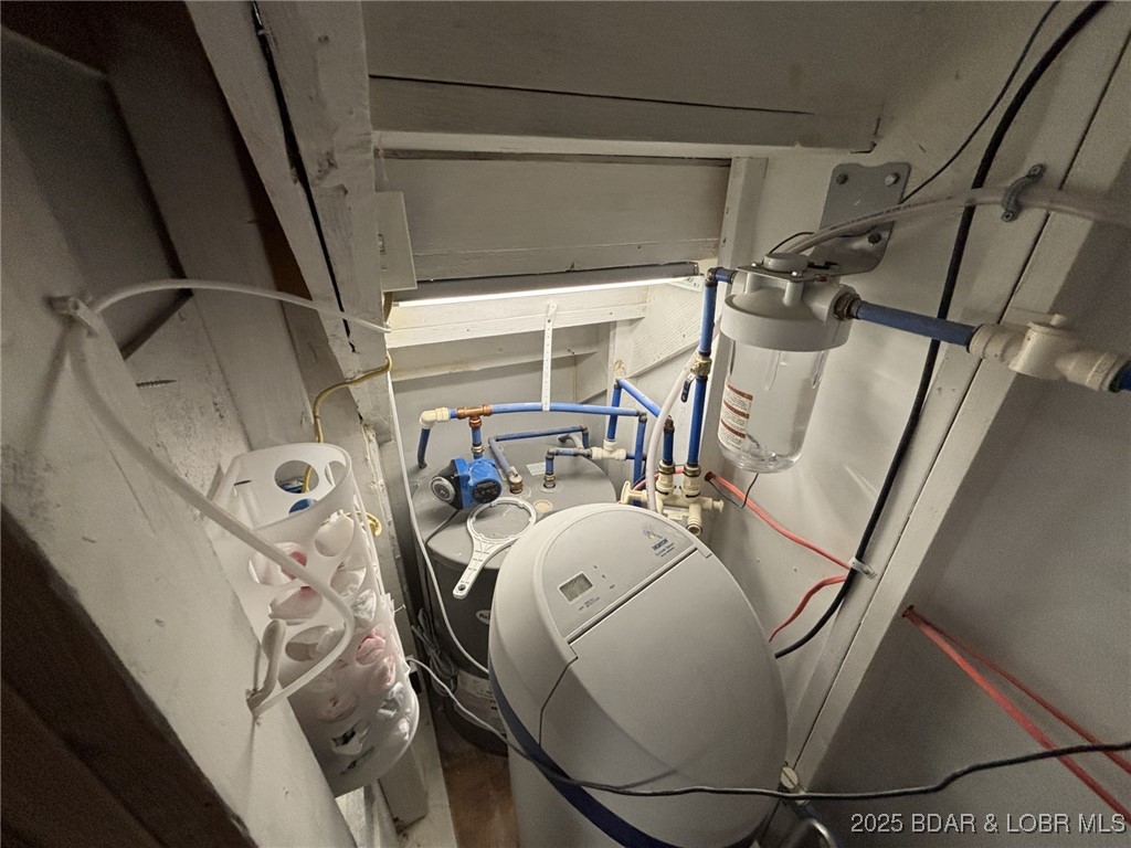 1265 Lick Creek Road Edwards, MO 65326 - Photo 23 of 27 utility with water heater and water softener