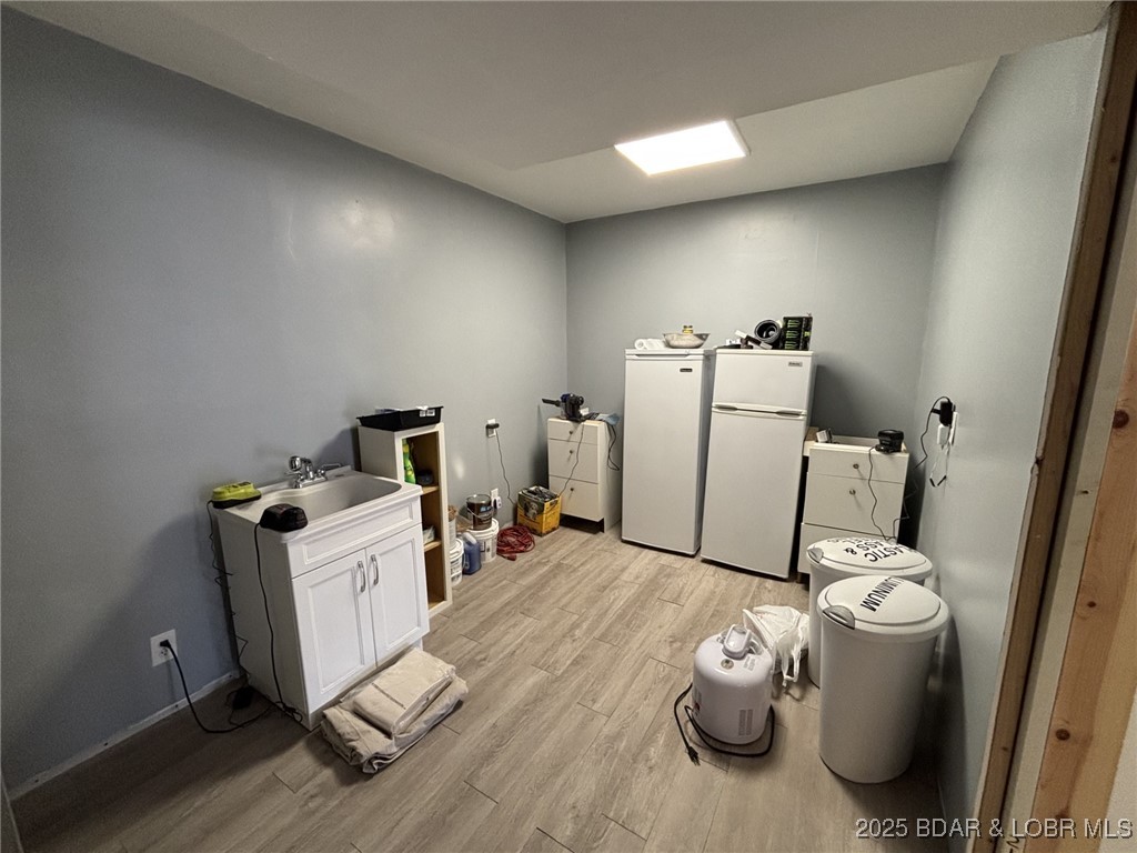 1265 Lick Creek Road Edwards, MO 65326 - Photo 24 of 27 view from water softener to rest of utility room