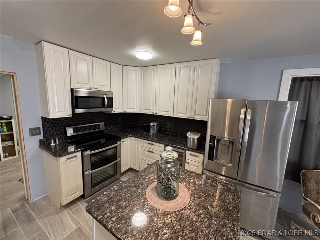 1265 Lick Creek Road Edwards, MO 65326 - Photo 6 of 27 lovely cabinets with ceramic floors