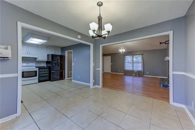 a view of a kitchen with a stove cabinets and wooden floor