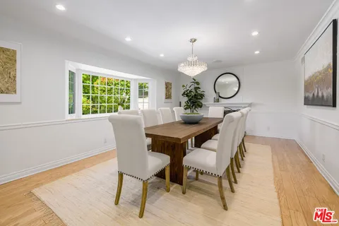 a kitchen with kitchen island granite countertop a stove oven and a refrigerator