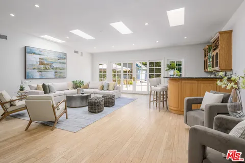 a view of living room with furniture and window