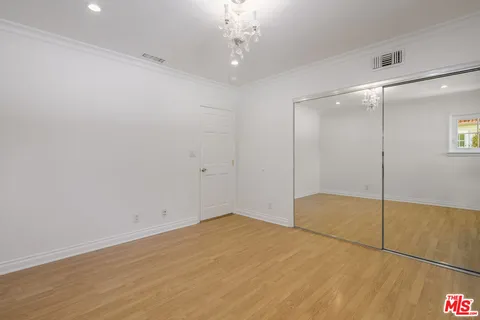 a room with pool table and windows