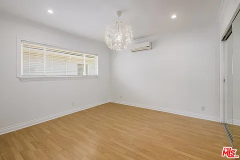 a view of a patio with a table chairs and a table