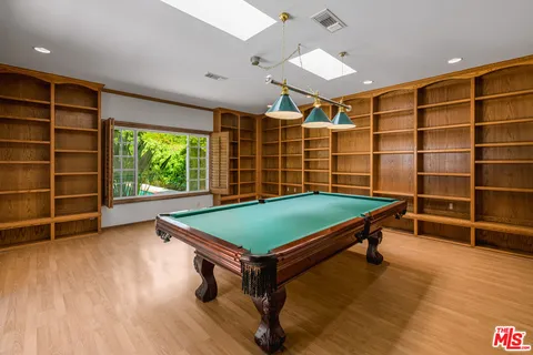 a swimming pool with outdoor seating and yard