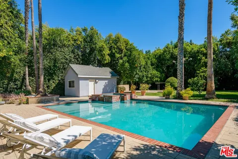 a view of a house with swimming pool