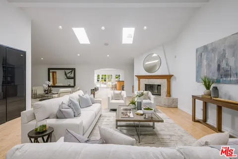 a living room with furniture and view of living room