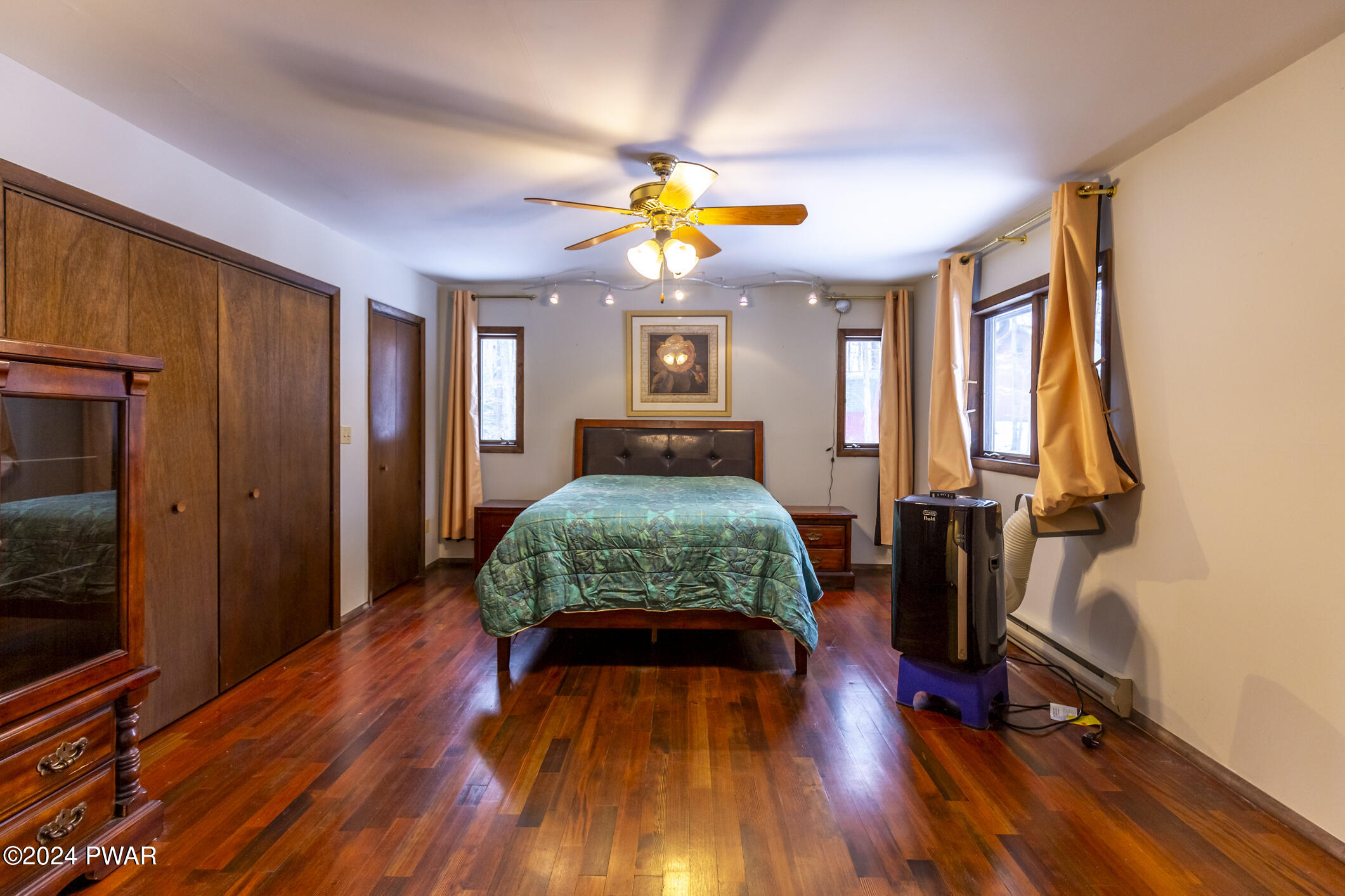 365 Northgate Road Lake Ariel, PA 18436 - Photo 24 of 68 a bedroom with a bed and wooden floor