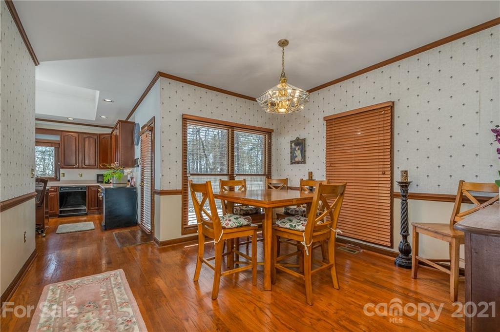 183 Alden Court Rutherfordton, NC 28139 - Photo 14 of 47 a view of a dining room with furniture and wooden floor