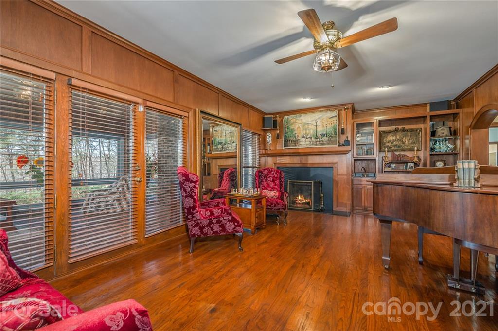 183 Alden Court Rutherfordton, NC 28139 - Photo 15 of 47 a living room with furniture a fireplace and wooden floor