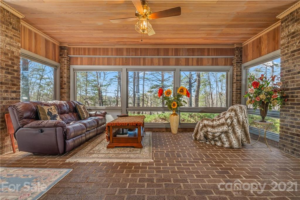 183 Alden Court Rutherfordton, NC 28139 - Photo 17 of 47 a living room with furniture a window and a flat screen tv