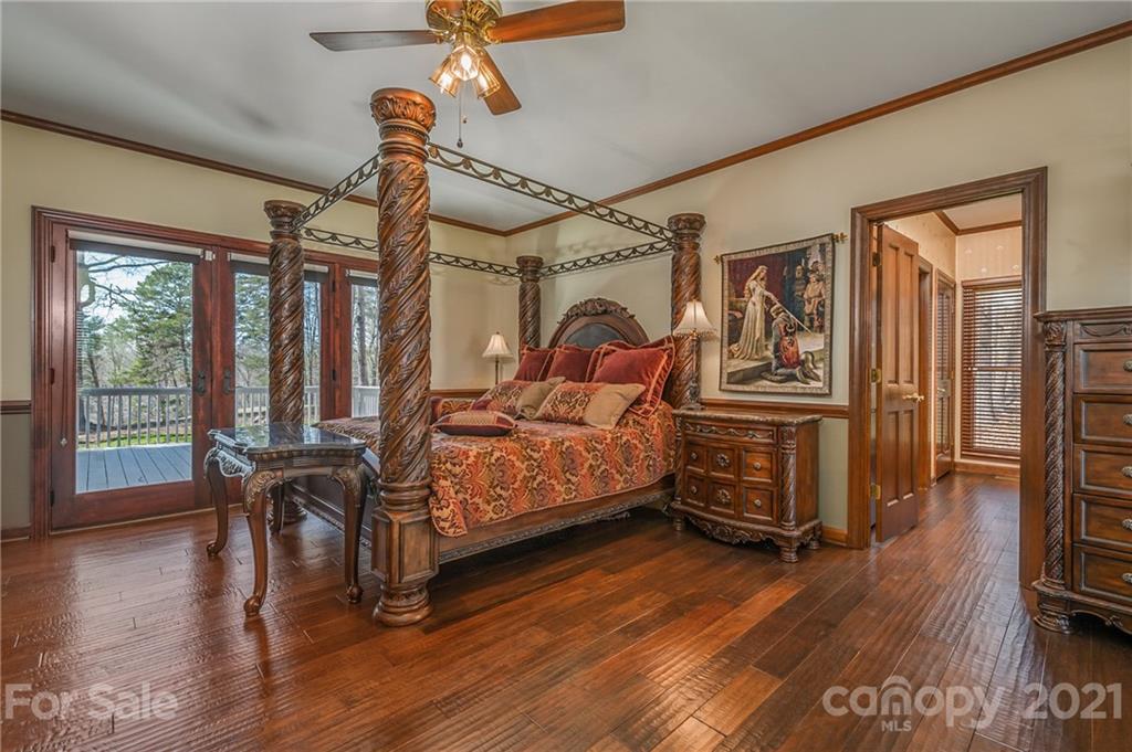 183 Alden Court Rutherfordton, NC 28139 - Photo 22 of 47 a bedroom with furniture window and wooden floor