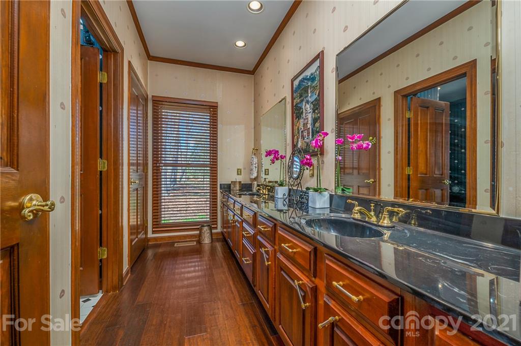 183 Alden Court Rutherfordton, NC 28139 - Photo 24 of 47 a hallway with sink and mirror