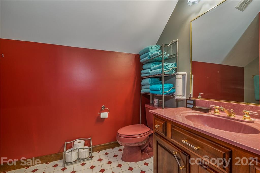 183 Alden Court Rutherfordton, NC 28139 - Photo 27 of 47 a bathroom with a sink a toilet and mirror