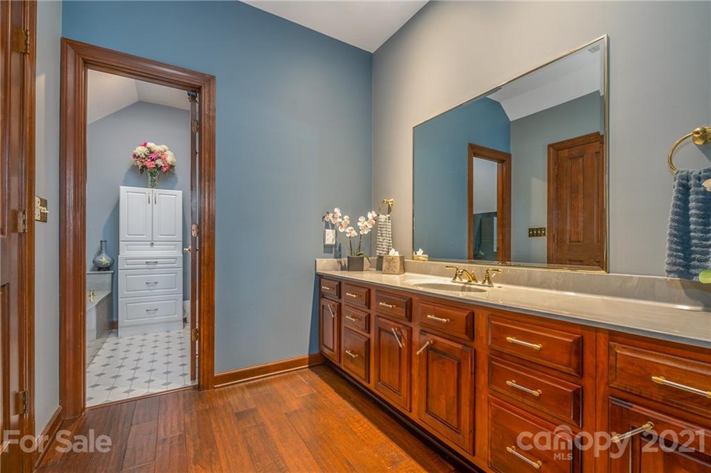 183 Alden Court Rutherfordton, NC 28139 - Photo 32 of 47 a spacious bathroom with a granite countertop sink and a mirror