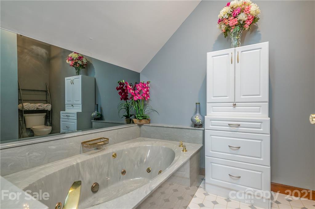 183 Alden Court Rutherfordton, NC 28139 - Photo 33 of 47 a bathroom with a tub sink and mirror