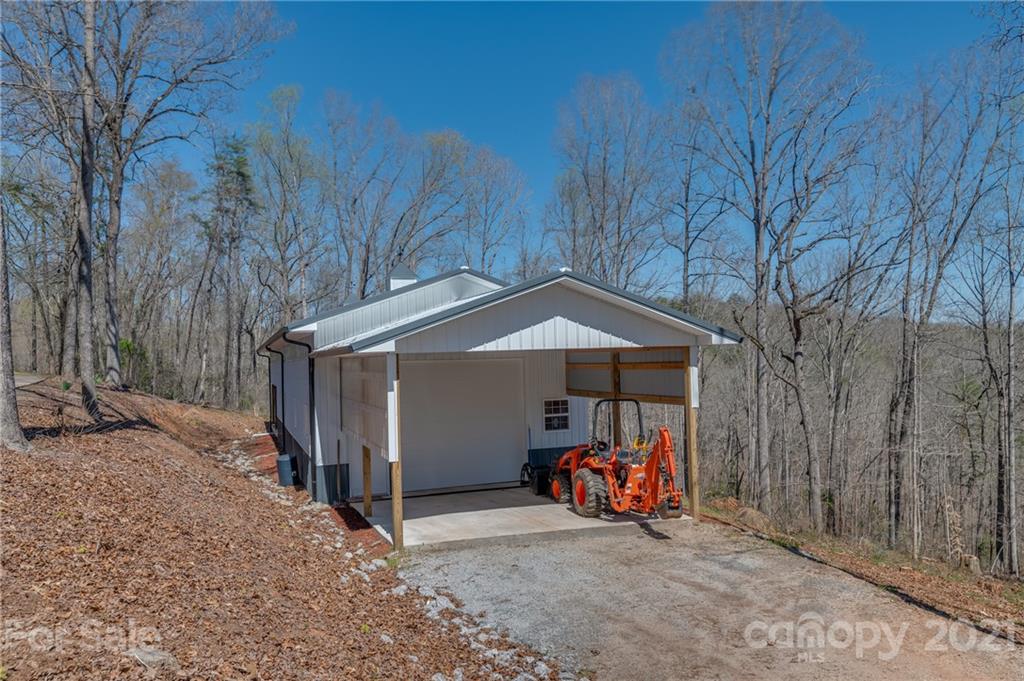 183 Alden Court Rutherfordton, NC 28139 - Photo 39 of 47 a view of a wooden house with large trees and furniture