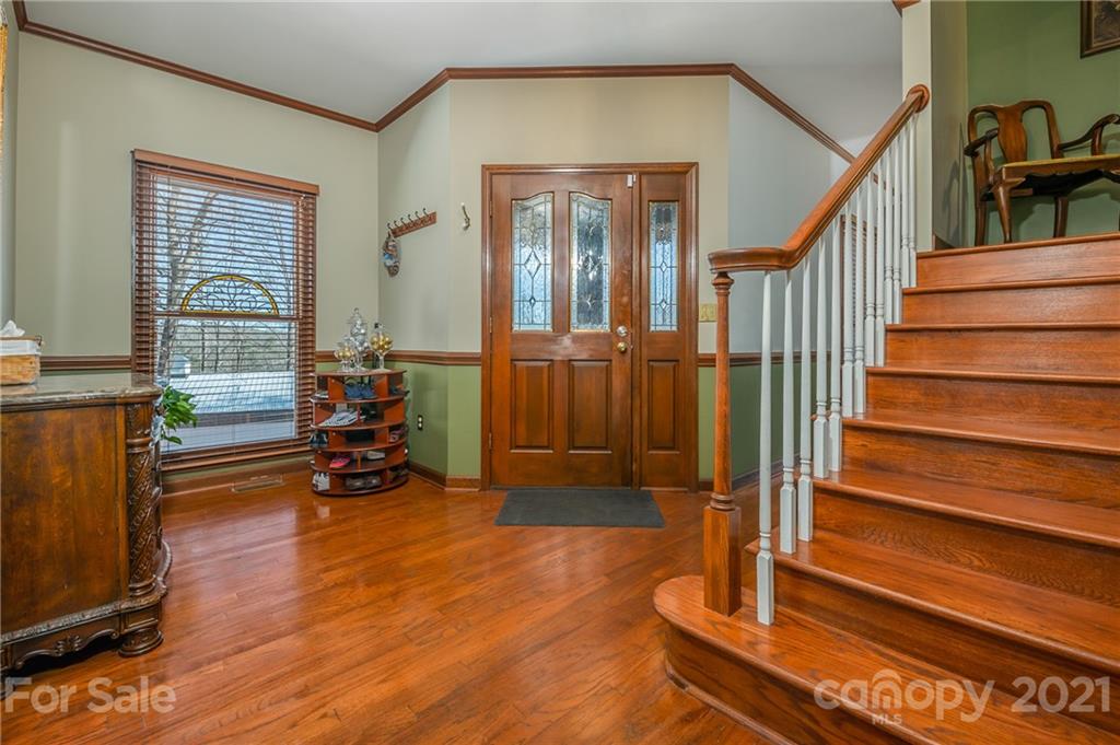 183 Alden Court Rutherfordton, NC 28139 - Photo 8 of 47 a view of staircase with furniture and a fireplace