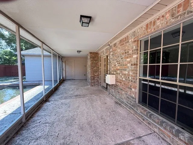a view of empty room with a large window
