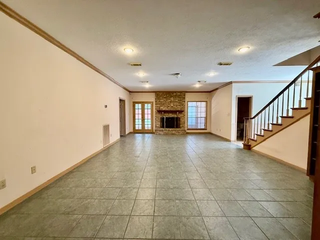 a view of an empty room with stairs