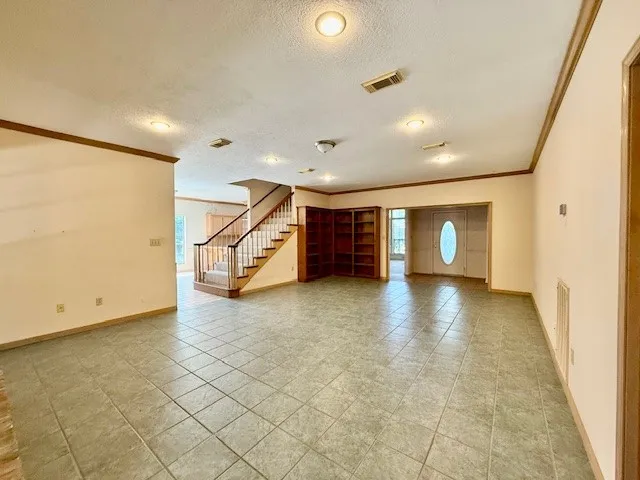 a view of a livingroom with a staircase