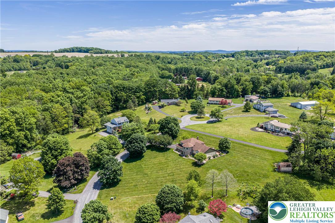 947 Tamenend Road Bath, PA 18014 - Photo 53 of 61 An aerial perspective reveals a serene community nestled amidst rolling hills and abundant greenery.