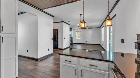 a living room with furniture a rug and a window