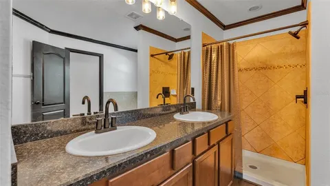 a view of a hallway with a ceiling fan