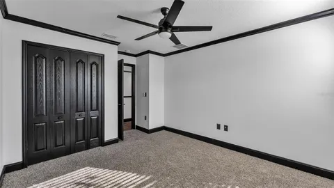 an aerial view of a residential houses with outdoor space