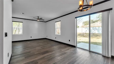 a living room with furniture a rug and a fireplace