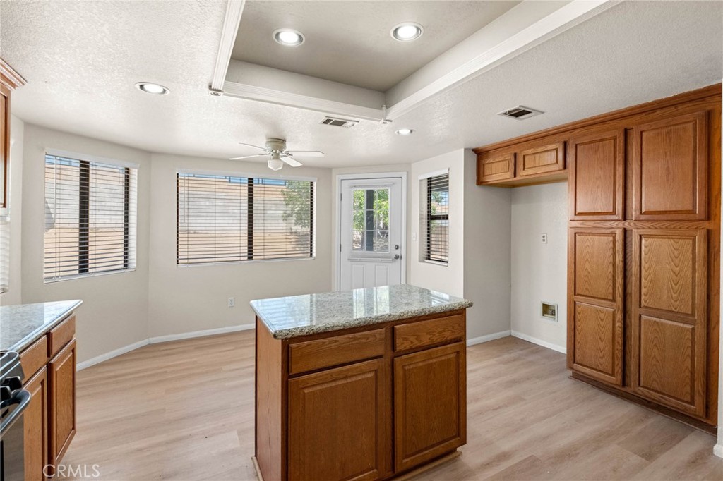 13904 Hidden Valley Road Victorville, CA 92395 - Photo 13 of 47 a kitchen with stainless steel appliances granite countertop a refrigerator and a sink