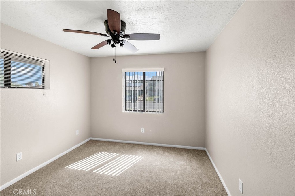 13904 Hidden Valley Road Victorville, CA 92395 - Photo 16 of 47 a view of an empty room with a window