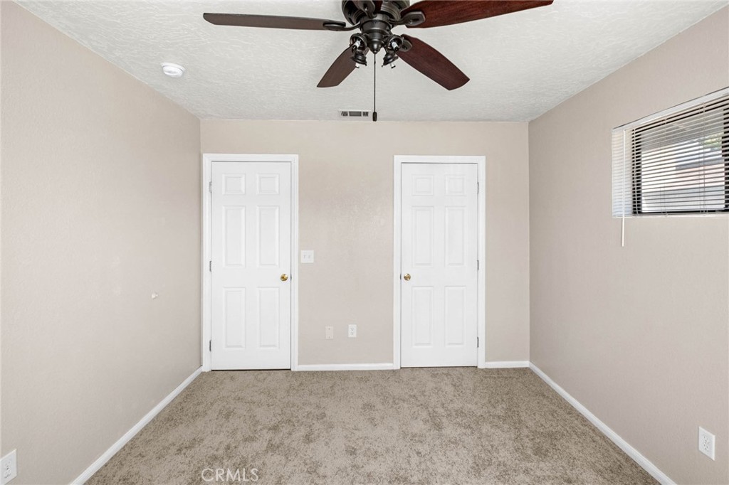 13904 Hidden Valley Road Victorville, CA 92395 - Photo 17 of 47 a view of an empty room